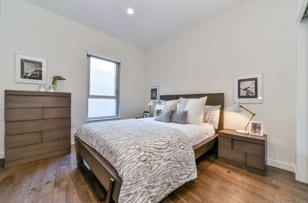 126 Salem Street, Unit 3 Boston, MA 02113 - Photo 5 of 14 a bedroom with a bed and a night stand