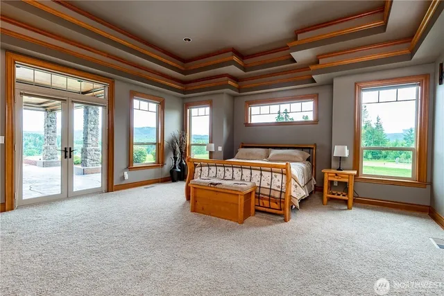 a bathroom with a tub a sink and mirror