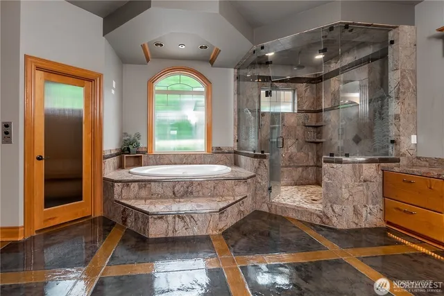 a bedroom with a bed and a view of balcony