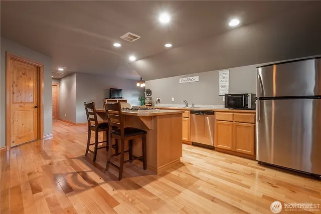 an aerial view of a house with garden space and a patio