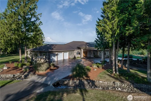 a view of backyard of house with seating space