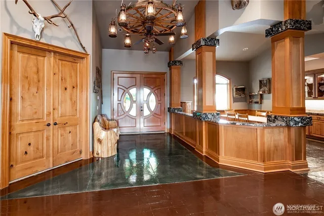 a living room with furniture window and a fireplace