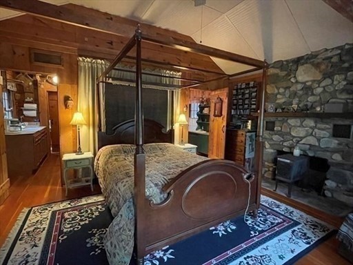 7 Burt Road Westhampton, MA 01027 - Photo 19 of 31 a bed room with a bed a chair and potted plant