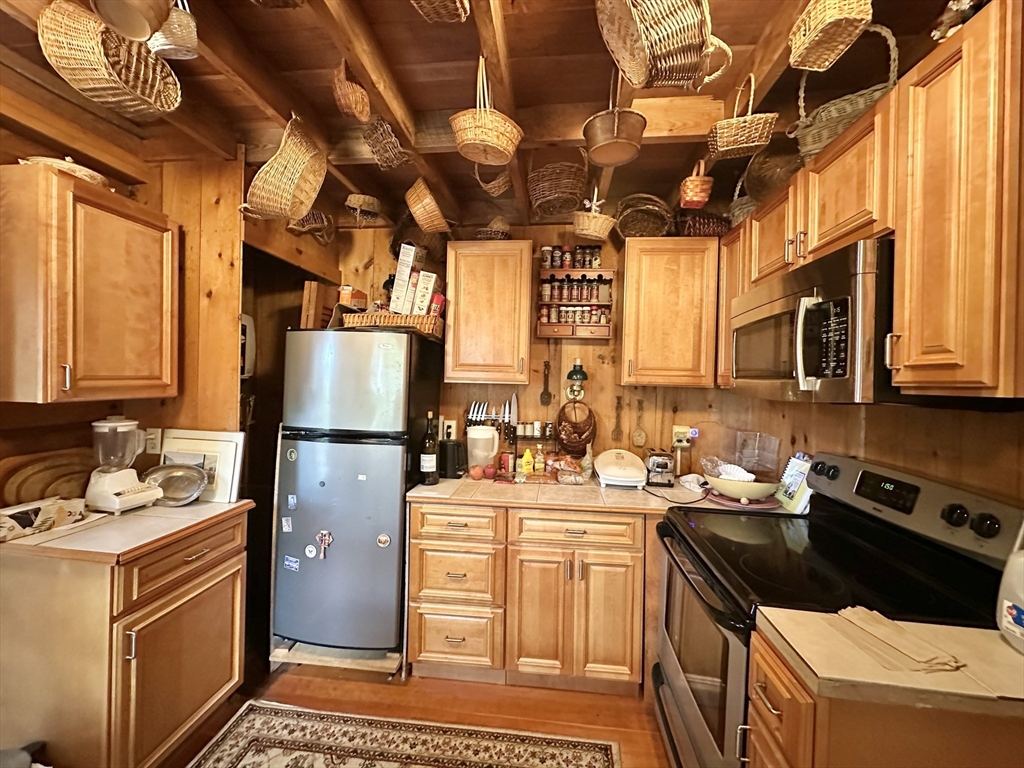 7 Burt Road Westhampton, MA 01027 - Photo 4 of 31 a kitchen with a sink appliances and cabinets