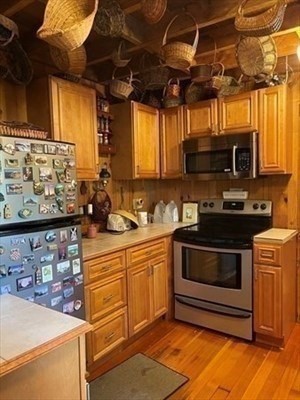 7 Burt Road Westhampton, MA 01027 - Photo 6 of 31 a kitchen with stainless steel appliances a stove a sink and a microwave