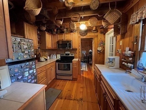 7 Burt Road Westhampton, MA 01027 - Photo 7 of 31 a kitchen with stainless steel appliances granite countertop a sink a stove top oven a chimney and a center island
