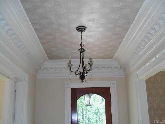 7830 Monument Lane Raleigh, NC 27615 - Photo 8 of 10 Entry Hall features Elegant Millwork and Wallpaper on Ceiling