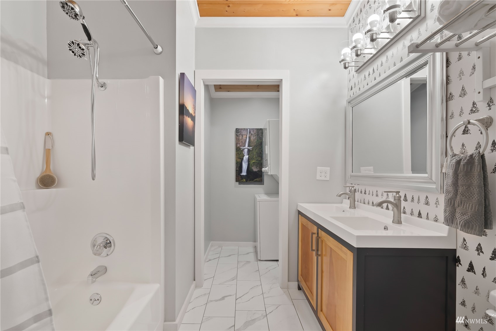 51 East Canyon View Road Belfair, WA 98528 - Photo 14 of 35 a bathroom with a double vanity sink a mirror and a bathtub