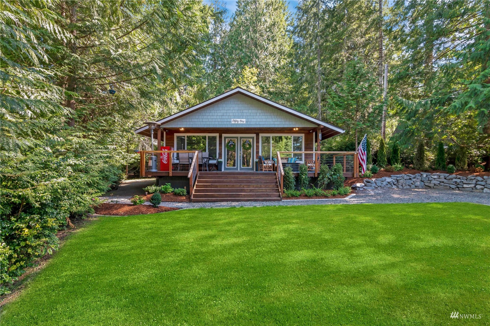 51 East Canyon View Road Belfair, WA 98528 - Photo 23 of 35 a front view of a house with garden