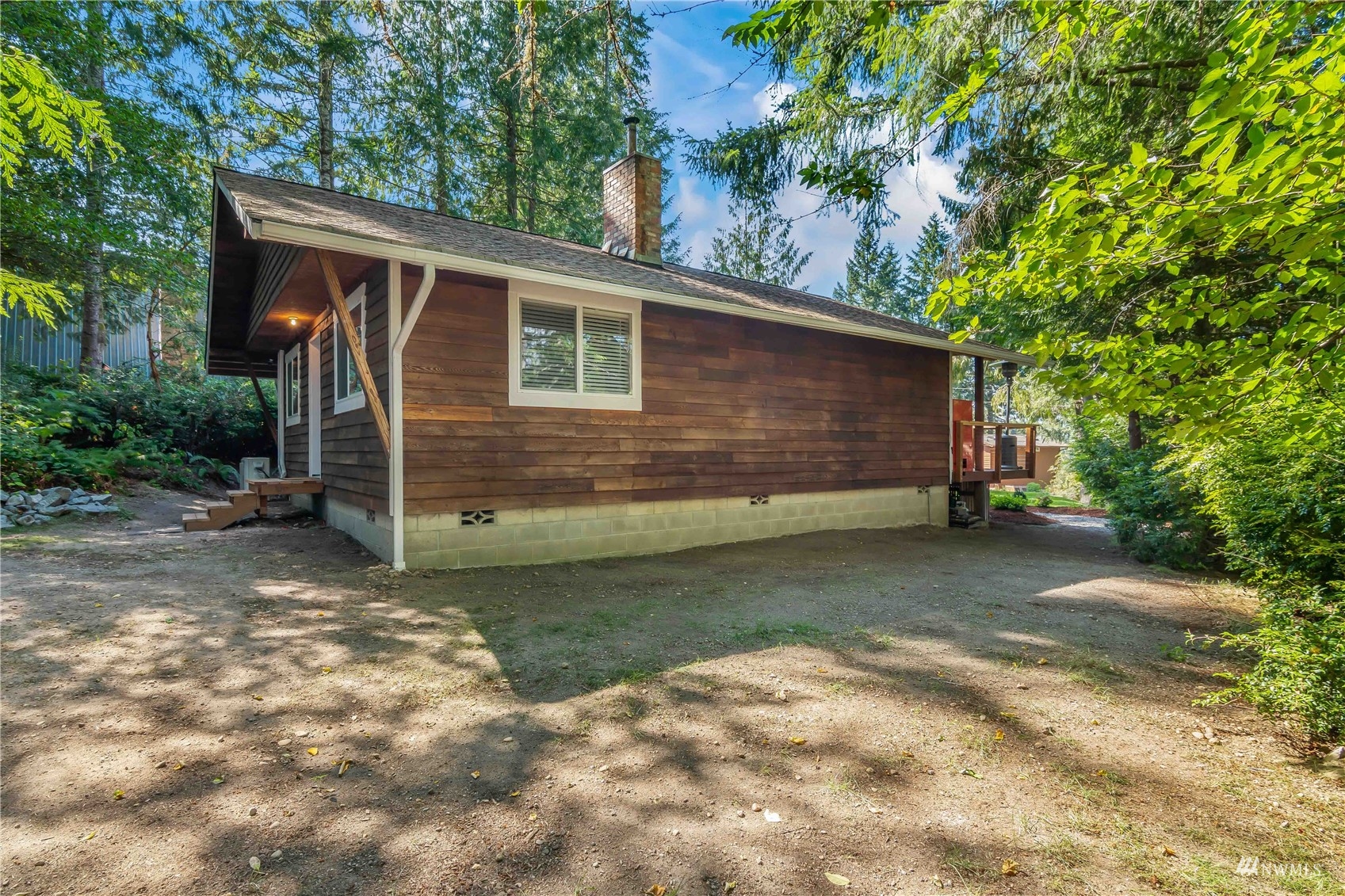 51 East Canyon View Road Belfair, WA 98528 - Photo 24 of 35 a backyard of a house with lots of green space