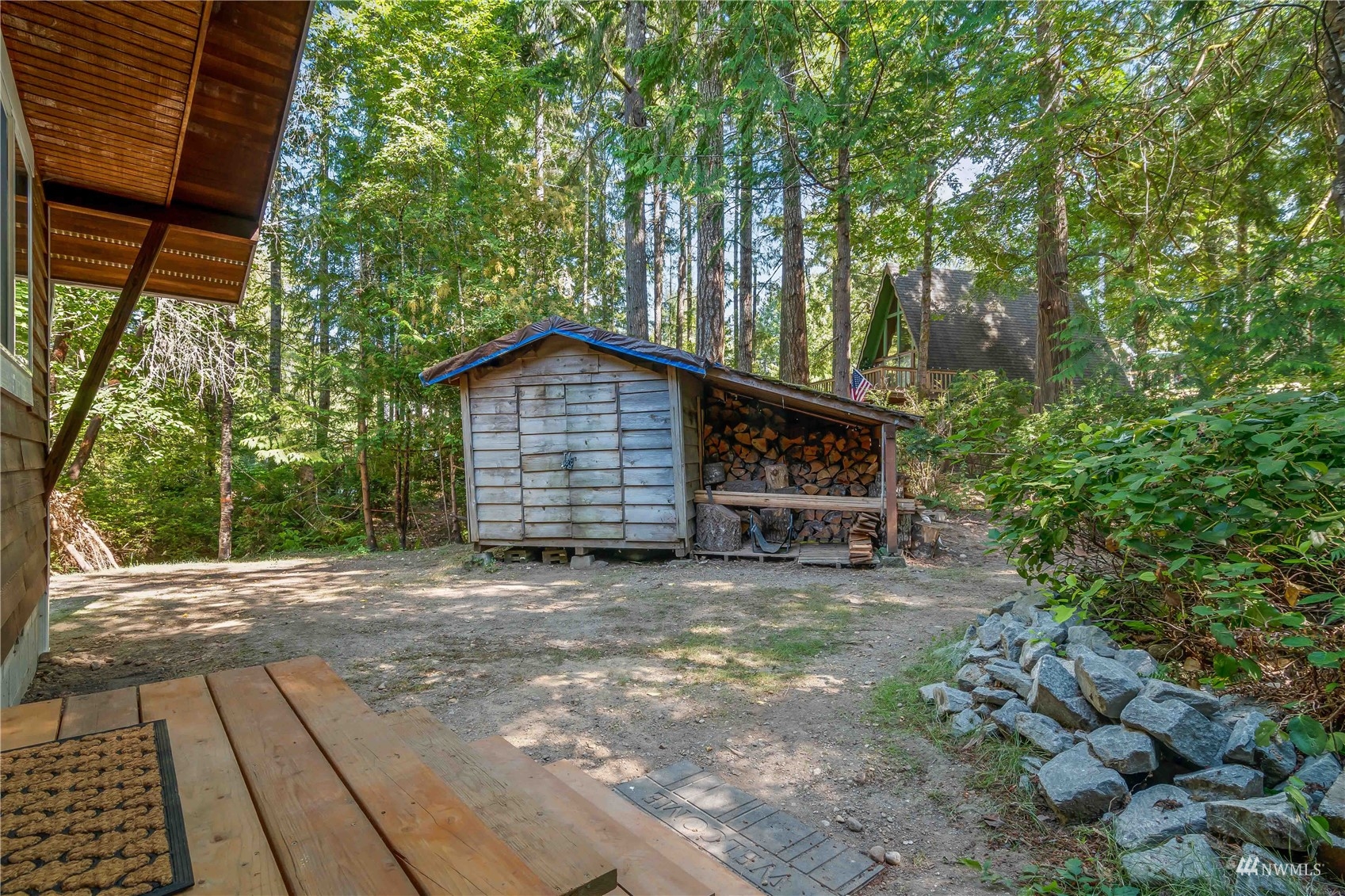 51 East Canyon View Road Belfair, WA 98528 - Photo 26 of 35 a view of a house with a yard