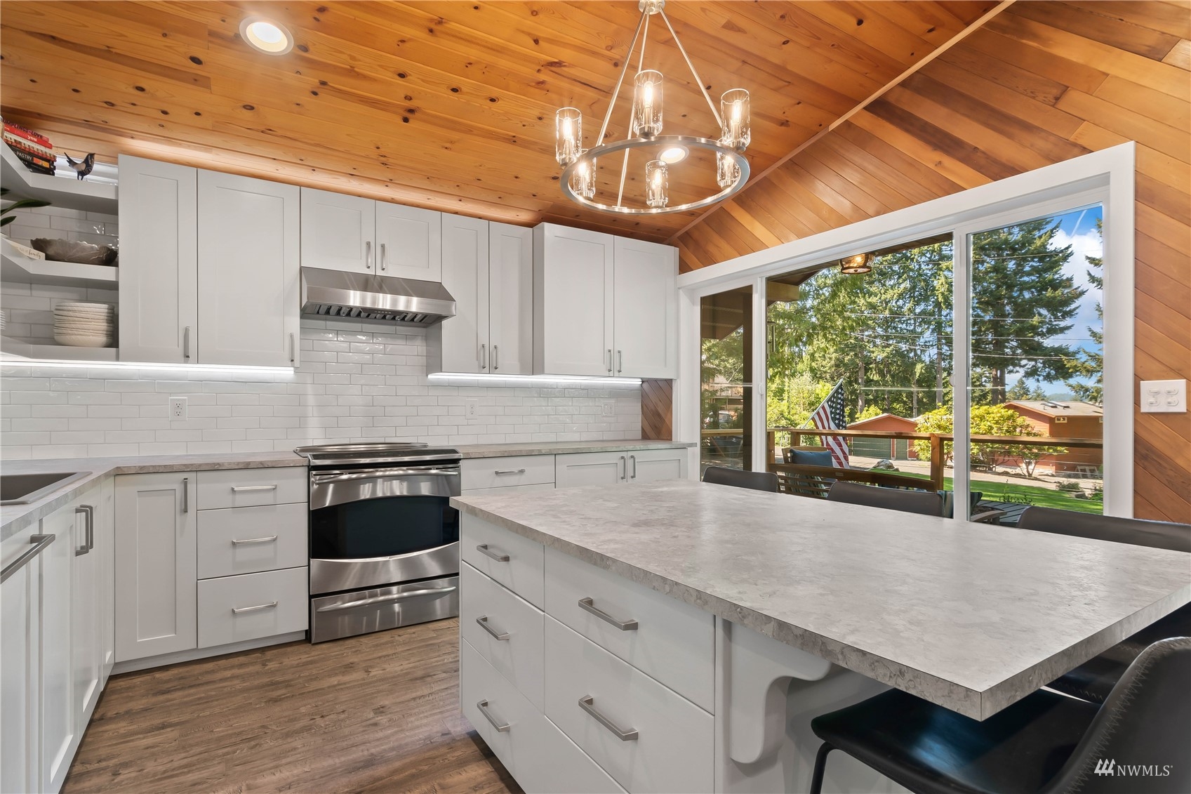51 East Canyon View Road Belfair, WA 98528 - Photo 3 of 35 a kitchen with stainless steel appliances granite countertop a stove and a view of living room