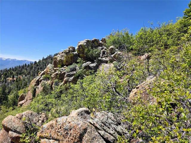 a view of mountain with sunset