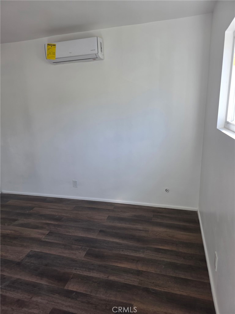 928 West Angeleno Avenue, Unit C Burbank, CA 91506 - Photo 1 of 14 a view of an empty room with wooden floor and a window