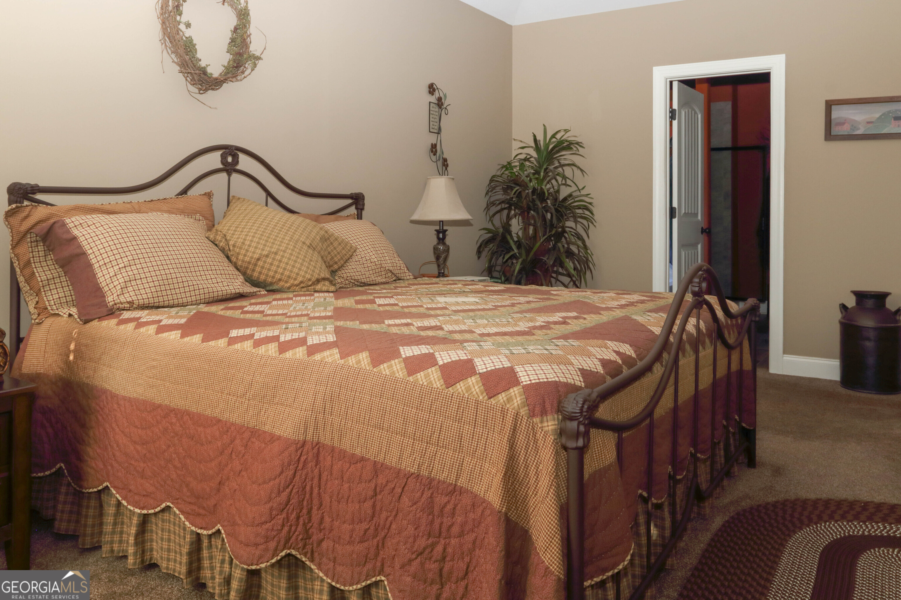 107 Westchester Trail Kathleen, GA 31047 - Photo 16 of 36 a bedroom with a bed and potted plant on the dresser