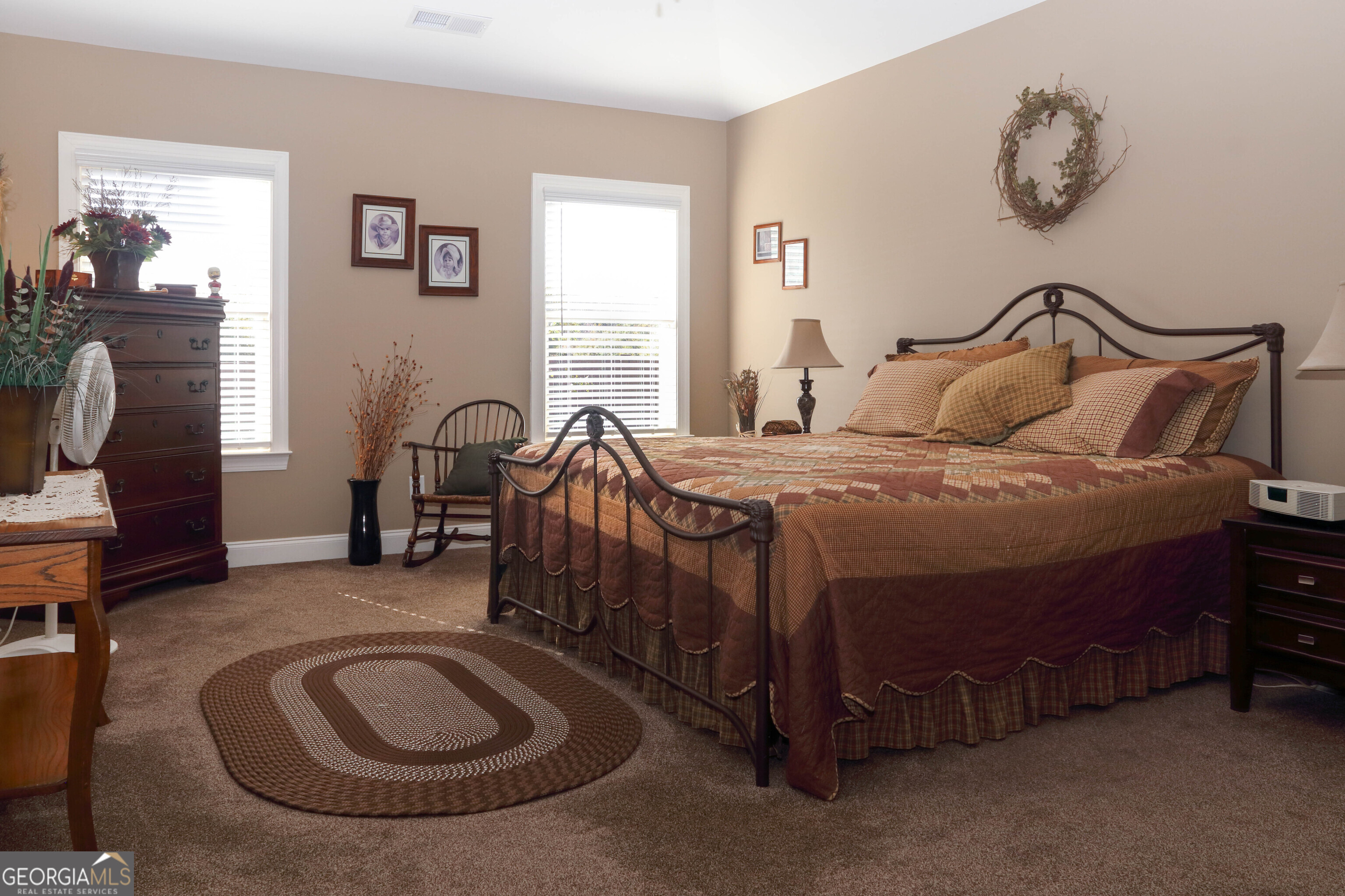 107 Westchester Trail Kathleen, GA 31047 - Photo 17 of 36 a bedroom with a bed a table and chair