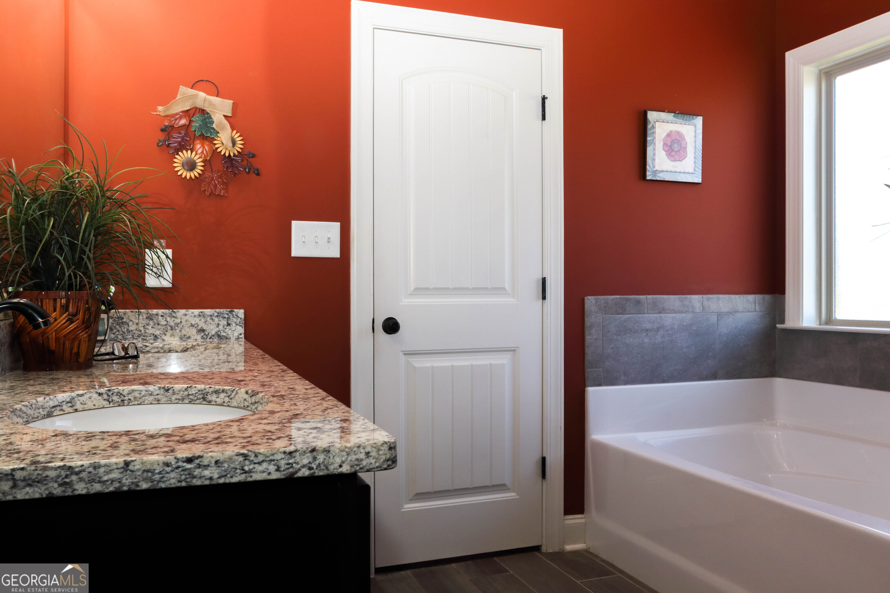107 Westchester Trail Kathleen, GA 31047 - Photo 18 of 36 a bathroom with a granite countertop sink a mirror and a bathtub