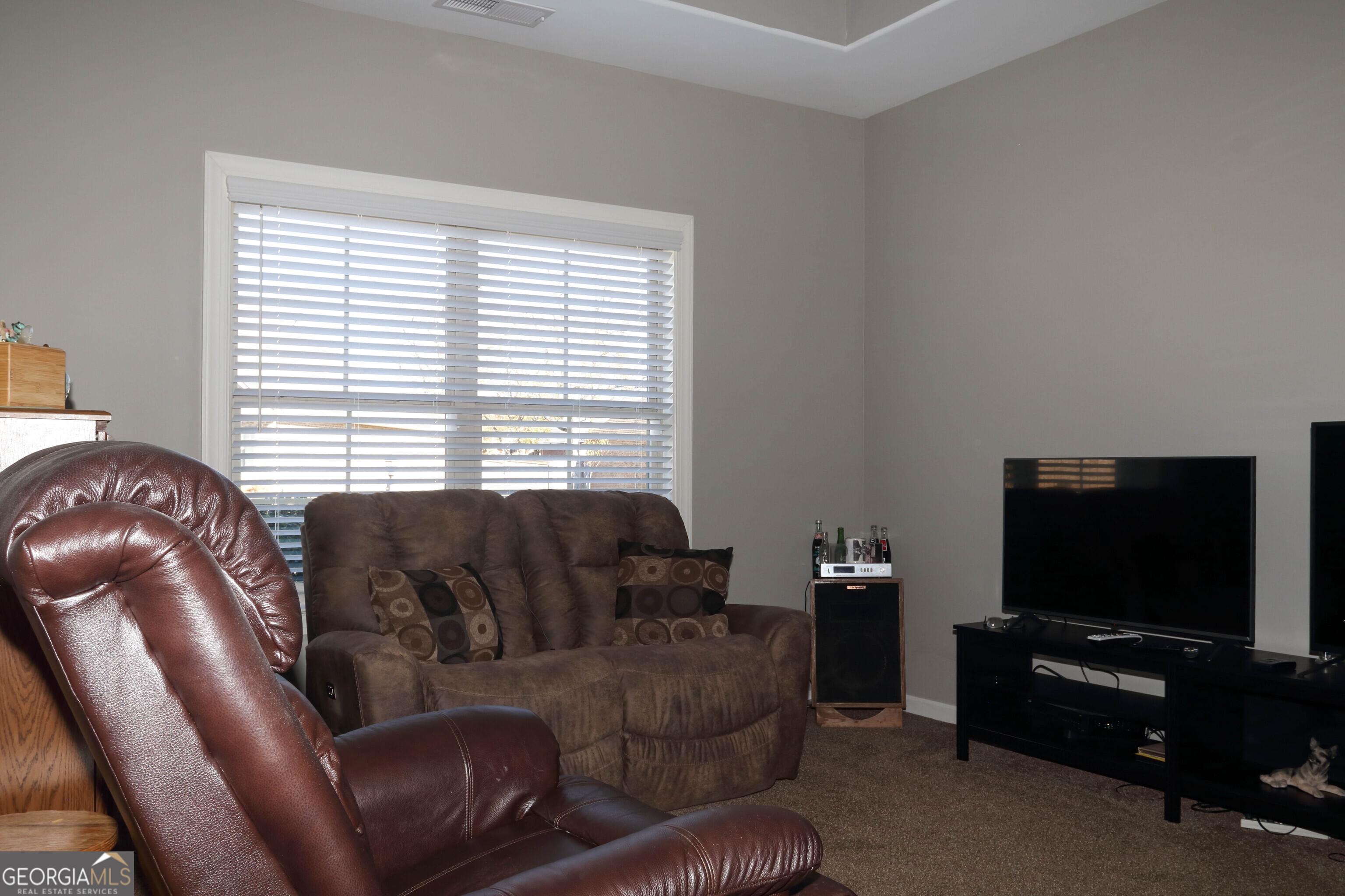 107 Westchester Trail Kathleen, GA 31047 - Photo 28 of 36 a living room with furniture and a flat screen tv
