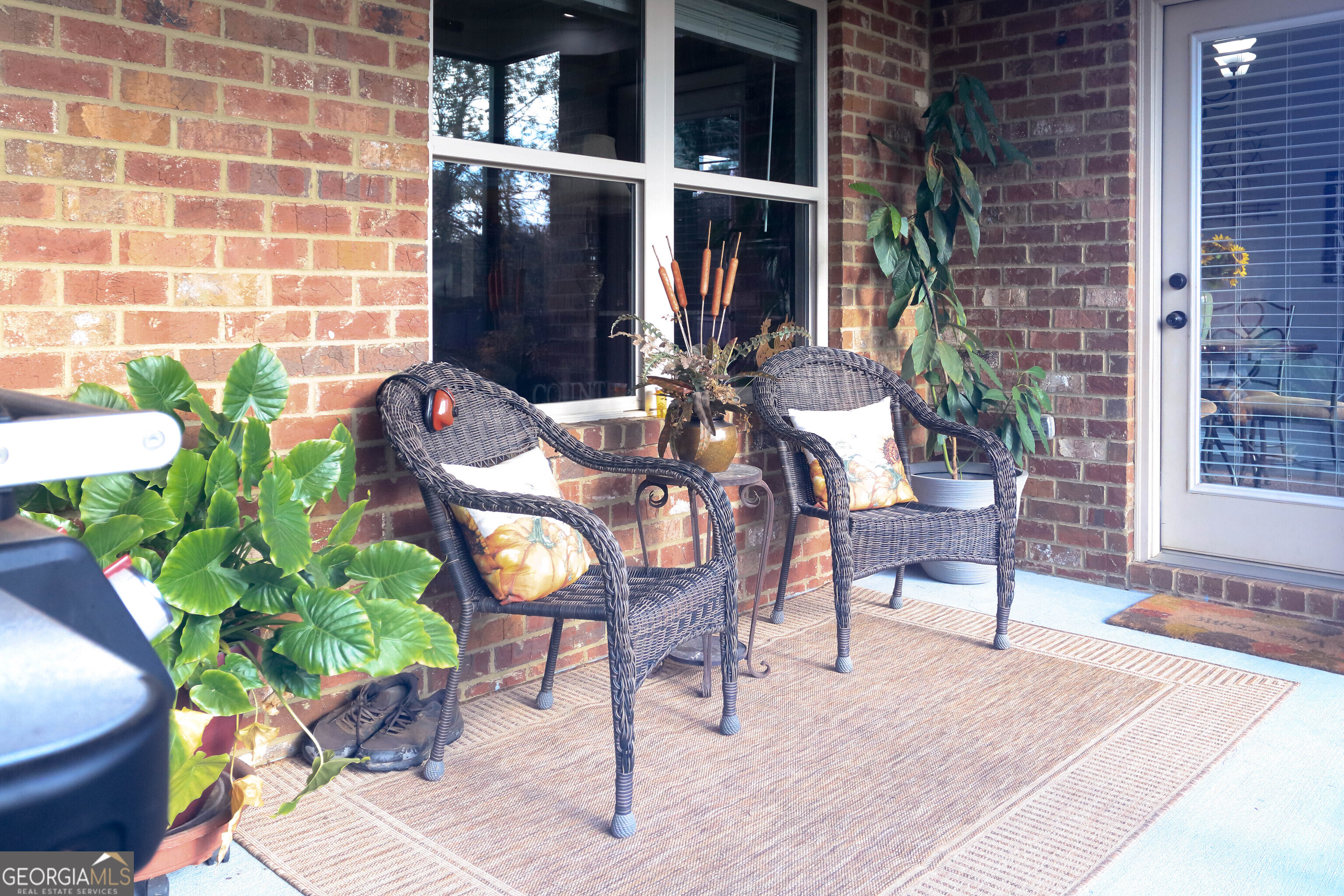 107 Westchester Trail Kathleen, GA 31047 - Photo 31 of 36 a view of a chairs and table in a patio