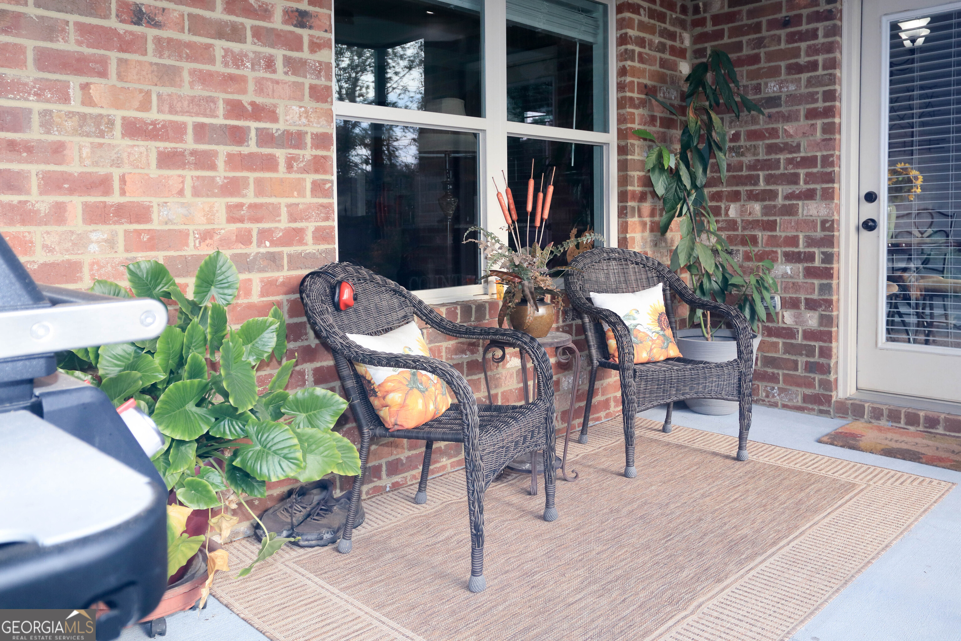 107 Westchester Trail Kathleen, GA 31047 - Photo 32 of 36 a view of a patio with table and chairs and potted plants