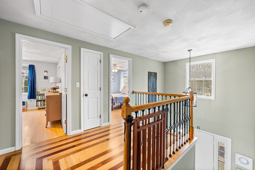40 Station Road Salem, MA 01970 - Photo 17 of 36 a view of a hallway with wooden floor and windows