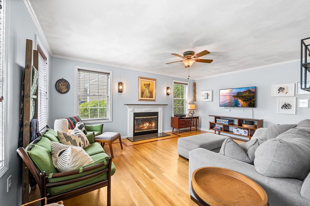 40 Station Road Salem, MA 01970 - Photo 2 of 36 a living room with furniture a fireplace and a flat screen tv