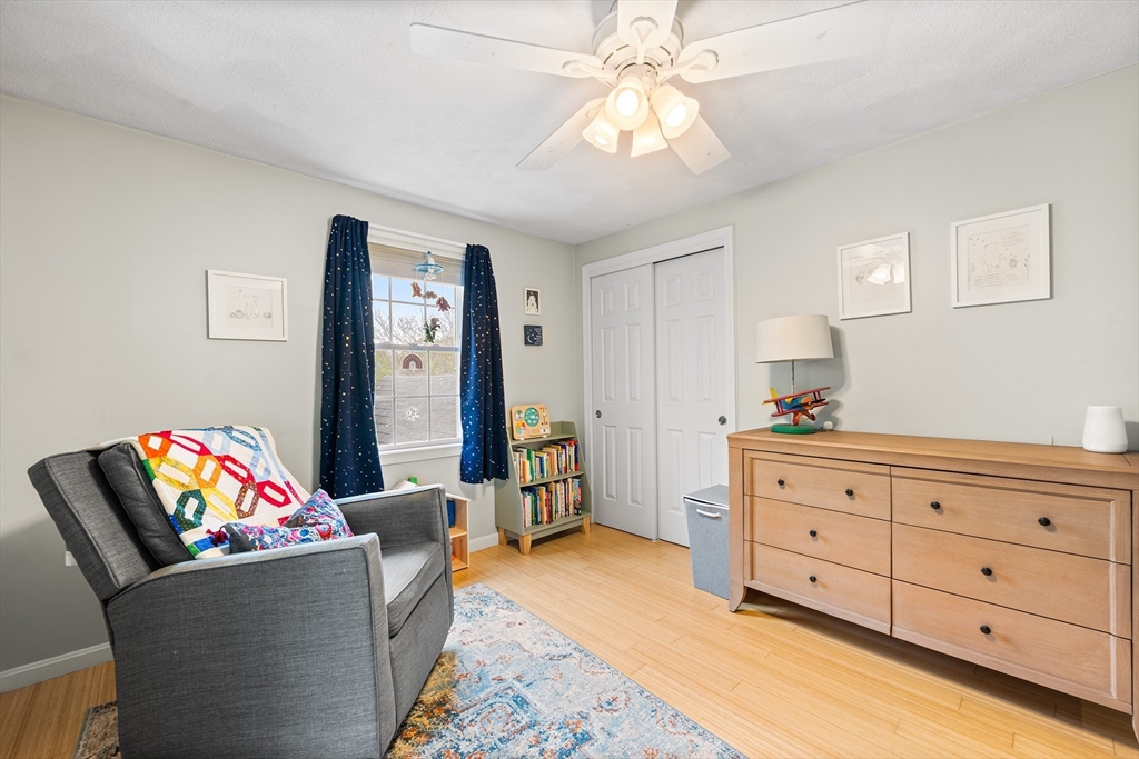 40 Station Road Salem, MA 01970 - Photo 24 of 36 a living room with furniture and a chandelier