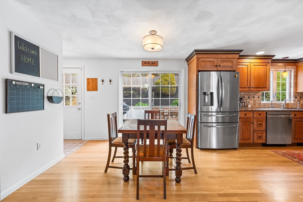 40 Station Road Salem, MA 01970 - Photo 5 of 36 a dining room with stainless steel appliances granite countertop a refrigerator and microwave