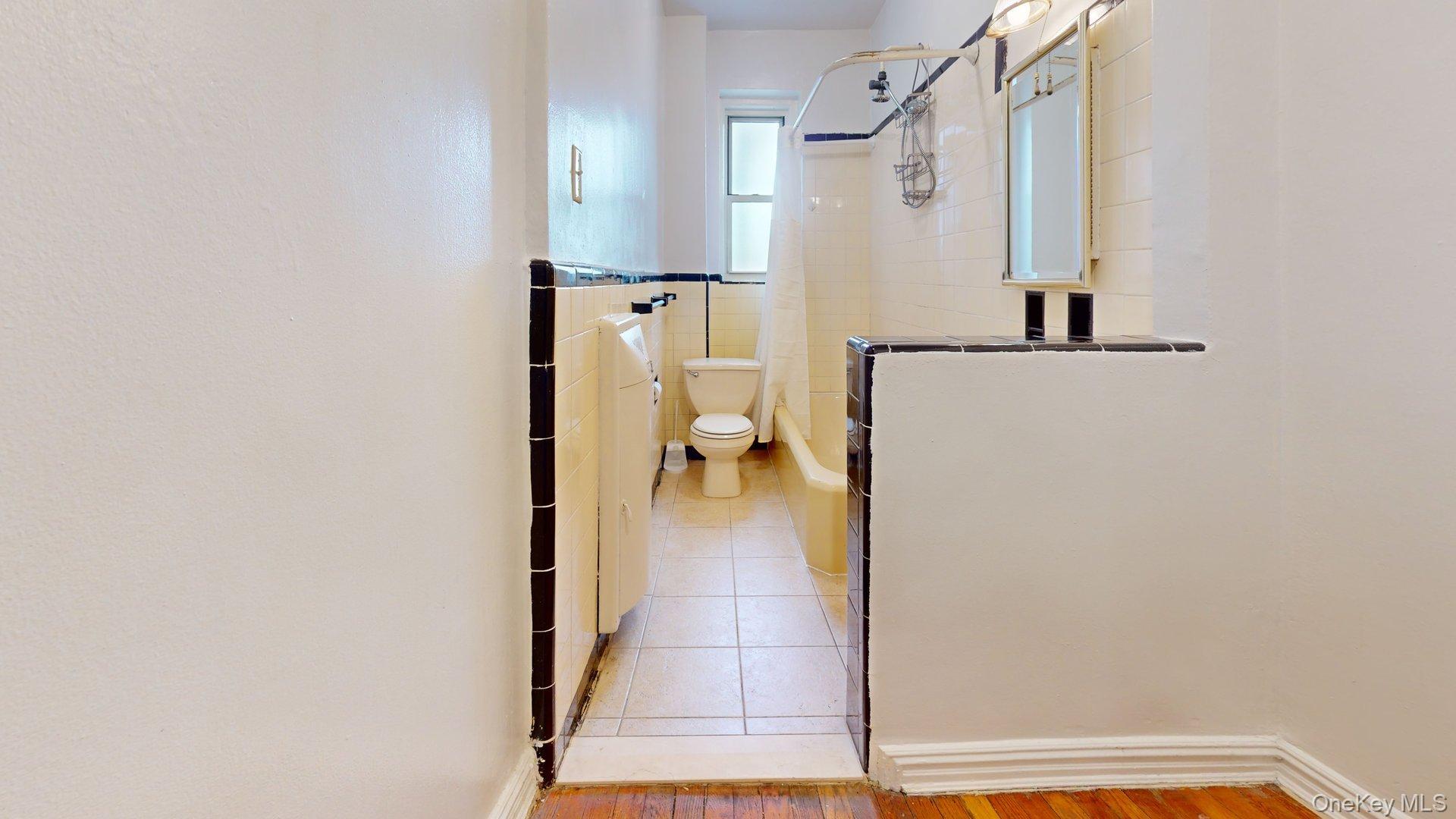 111-39 76th Road, Unit D8 Queens, NY 11375 - Photo 12 of 16 Oversized windowed bath with dressing area and linen closet