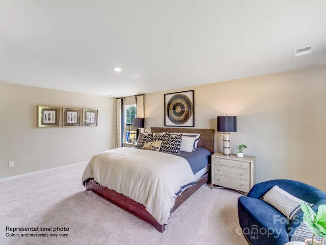 a bedroom with a bed furniture and a window