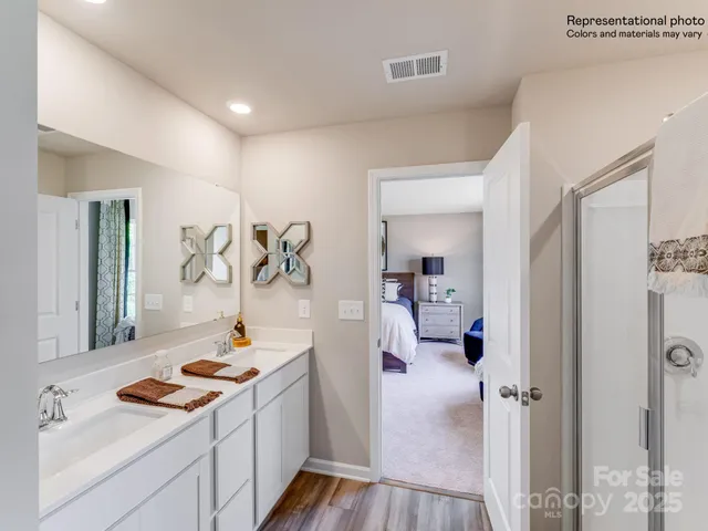 a living room with furniture and a walk in closet