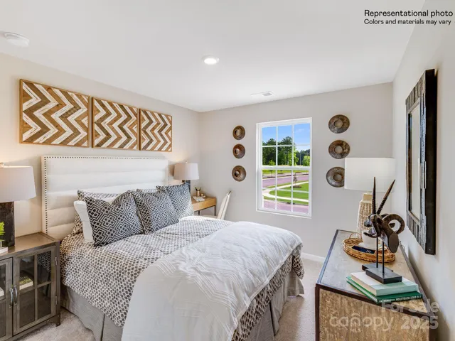 a view of a park with trees in the background