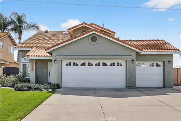 a front view of a house with a garage and a garage
