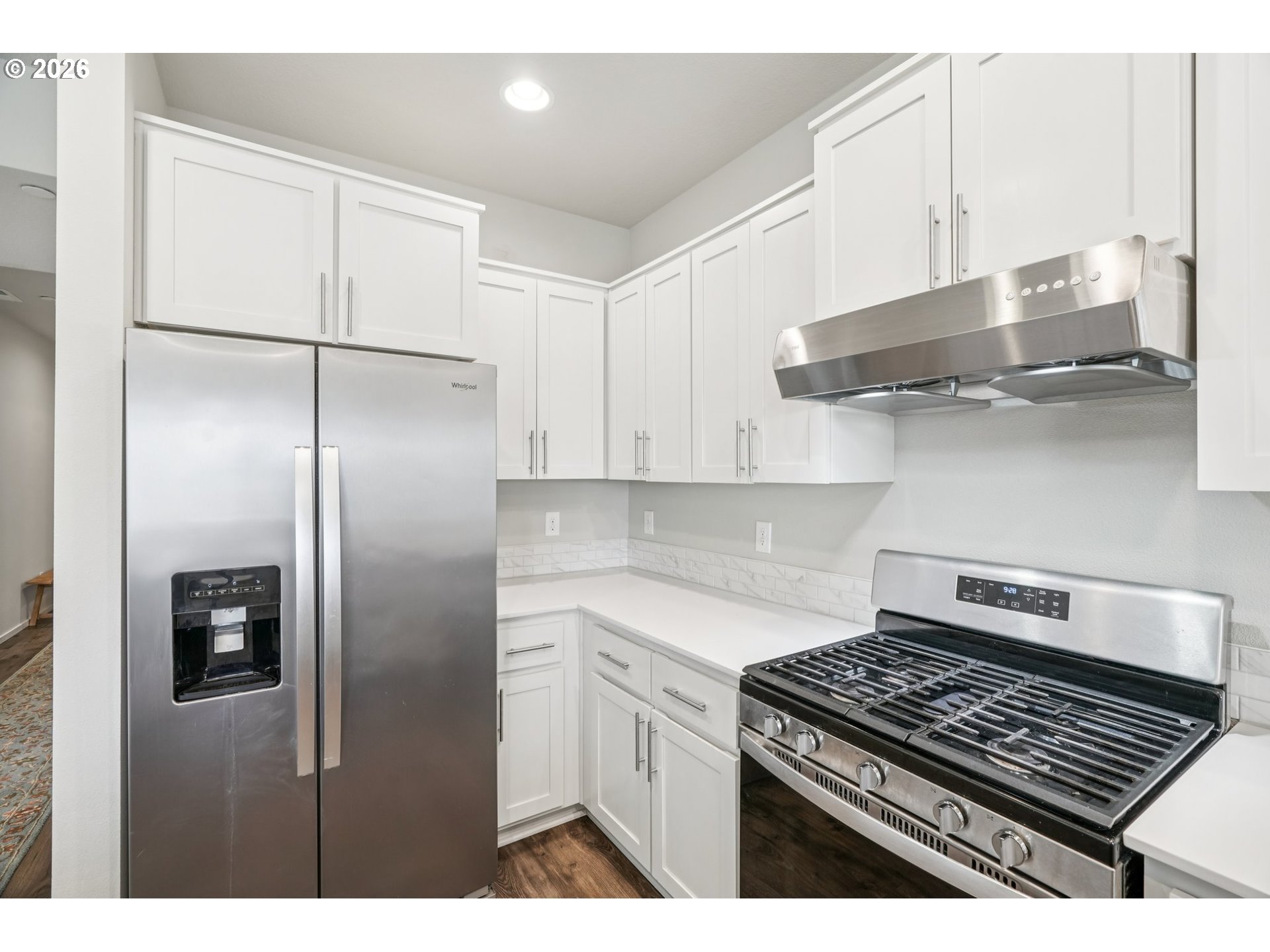 1712 Northeast Pioneer Lane Camas, WA 98607 - Photo 11 of 25 a kitchen with stainless steel appliances granite countertop a stove and a refrigerator