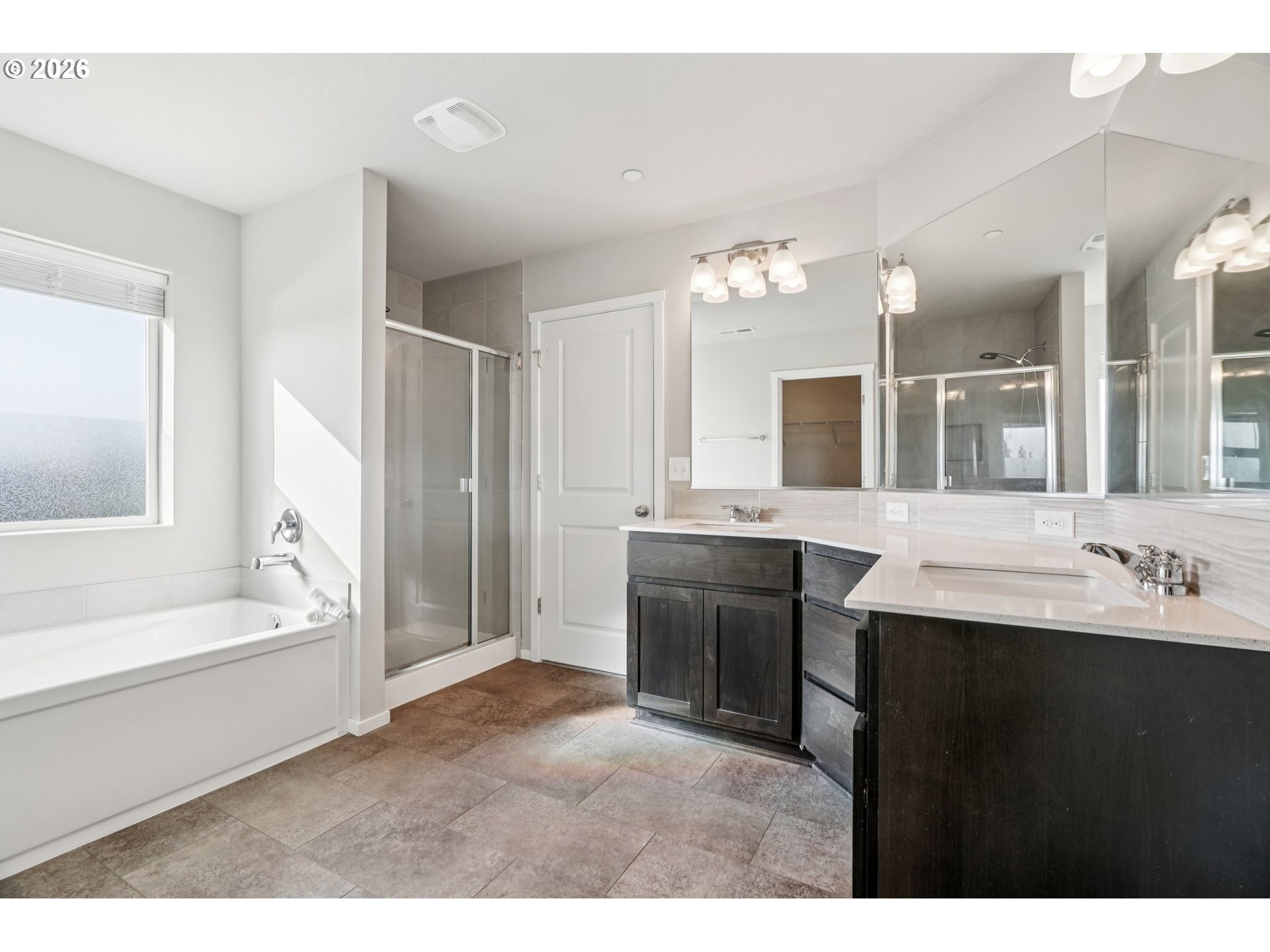 1712 Northeast Pioneer Lane Camas, WA 98607 - Photo 15 of 25 a bathroom with a tub a sink double vanity granite and a bathtub