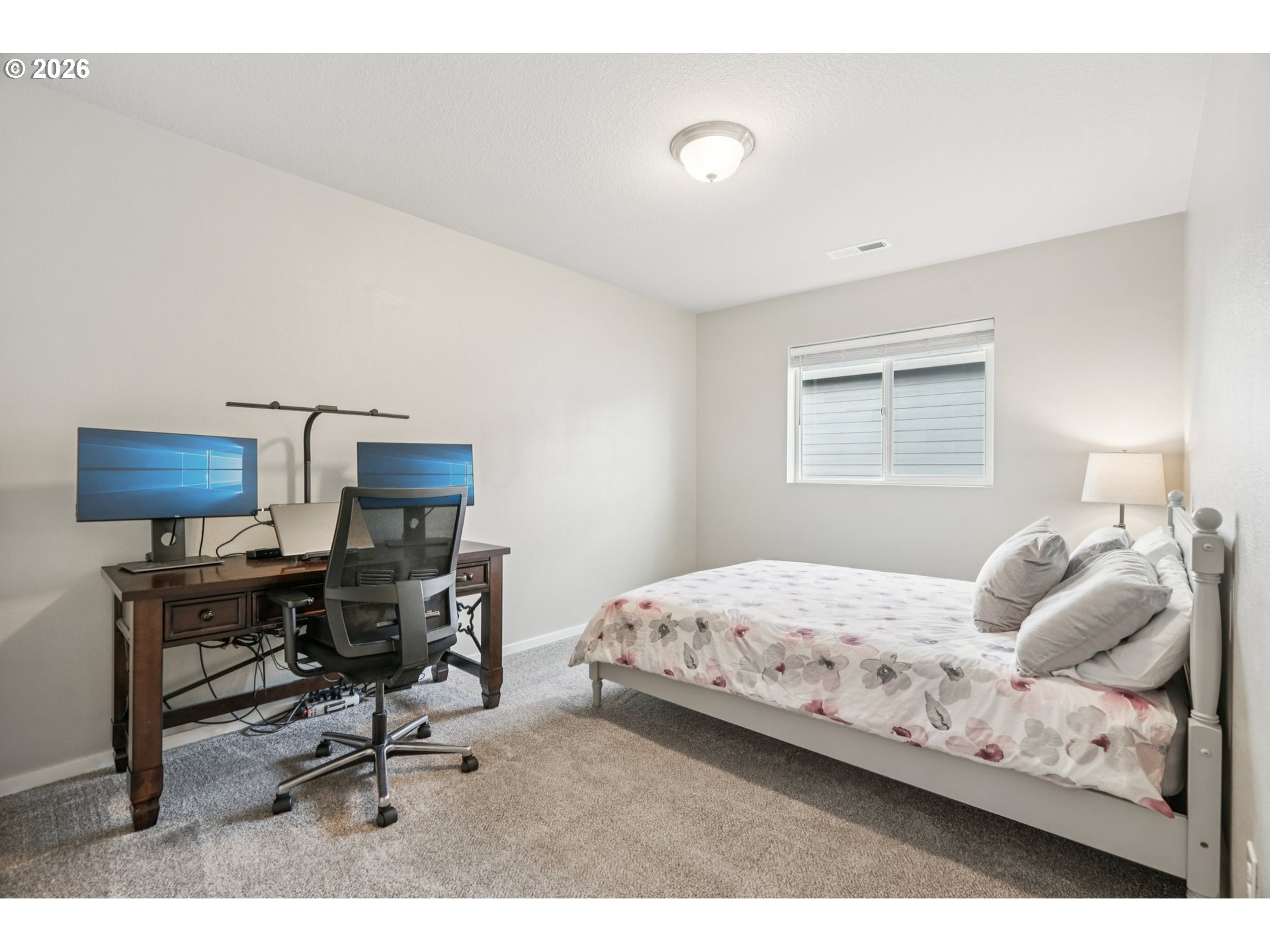 1712 Northeast Pioneer Lane Camas, WA 98607 - Photo 16 of 25 a bedroom with a bed a desk and chair