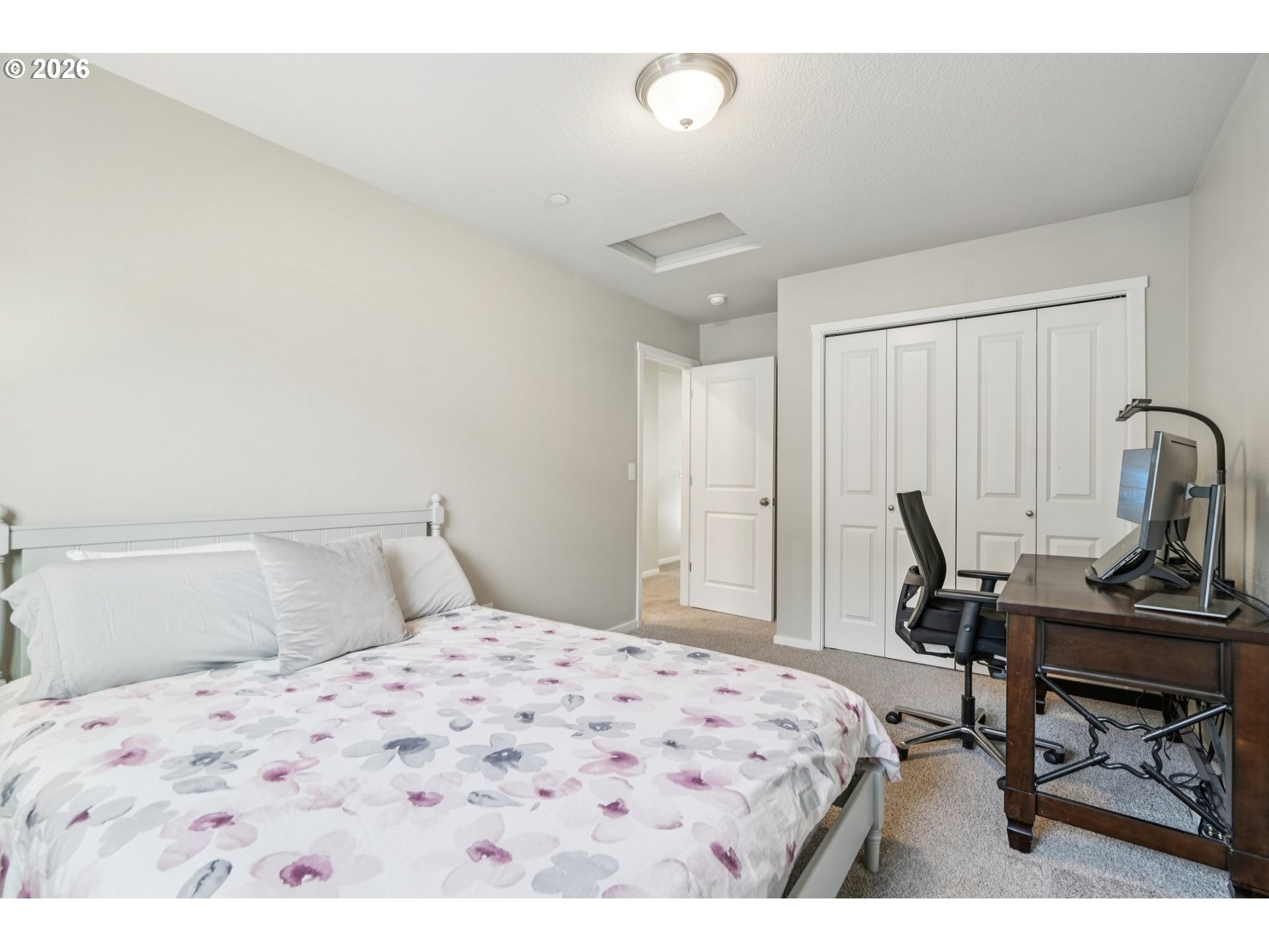 1712 Northeast Pioneer Lane Camas, WA 98607 - Photo 17 of 25 a bedroom with a bed a desk and chair