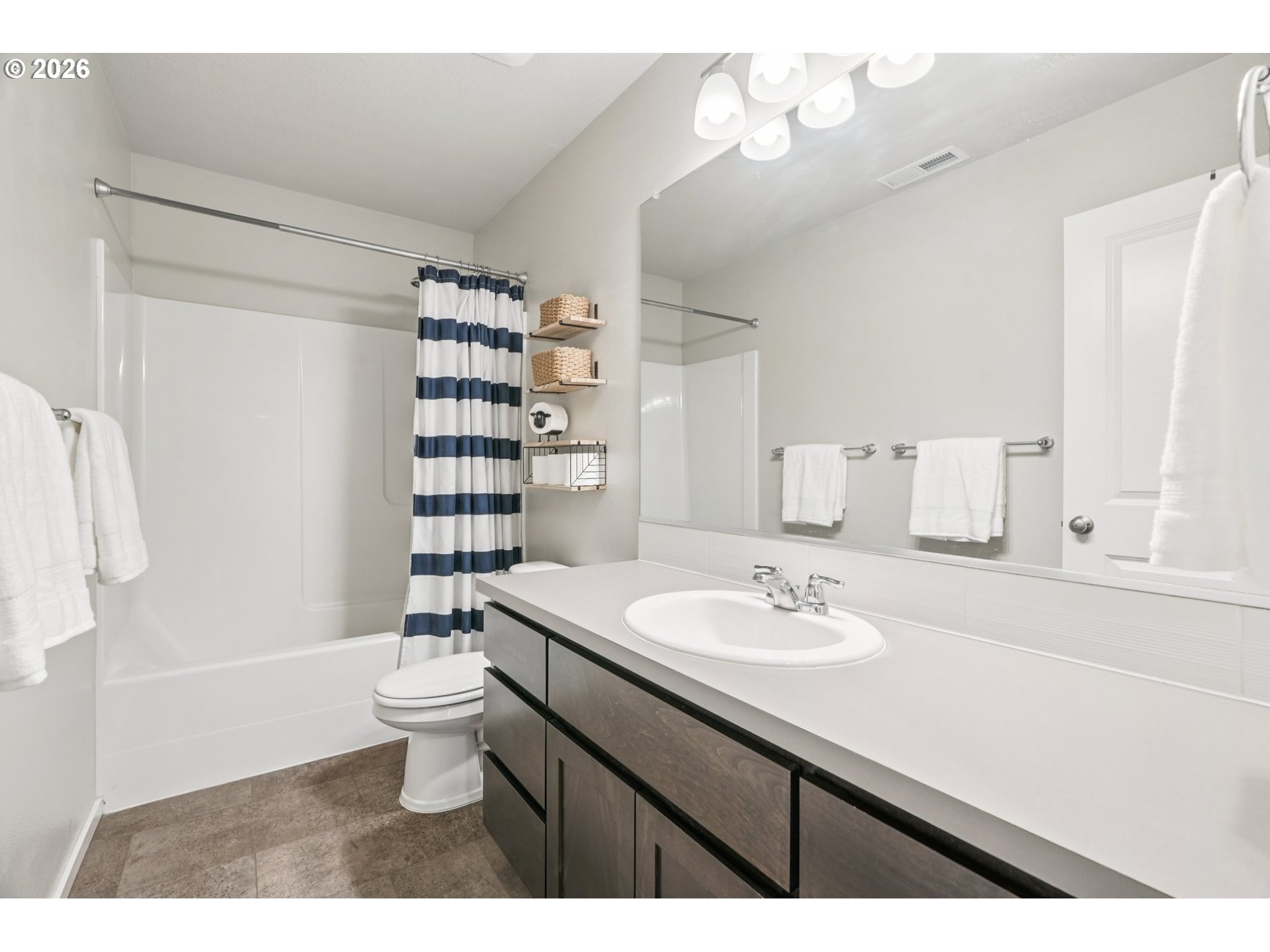 1712 Northeast Pioneer Lane Camas, WA 98607 - Photo 18 of 25 a bathroom with a sink a toilet and shower