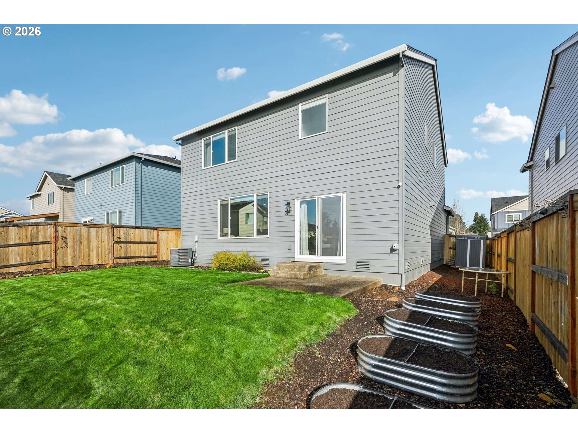 1712 Northeast Pioneer Lane Camas, WA 98607 - Photo 22 of 25 a backyard of a house with table and chairs