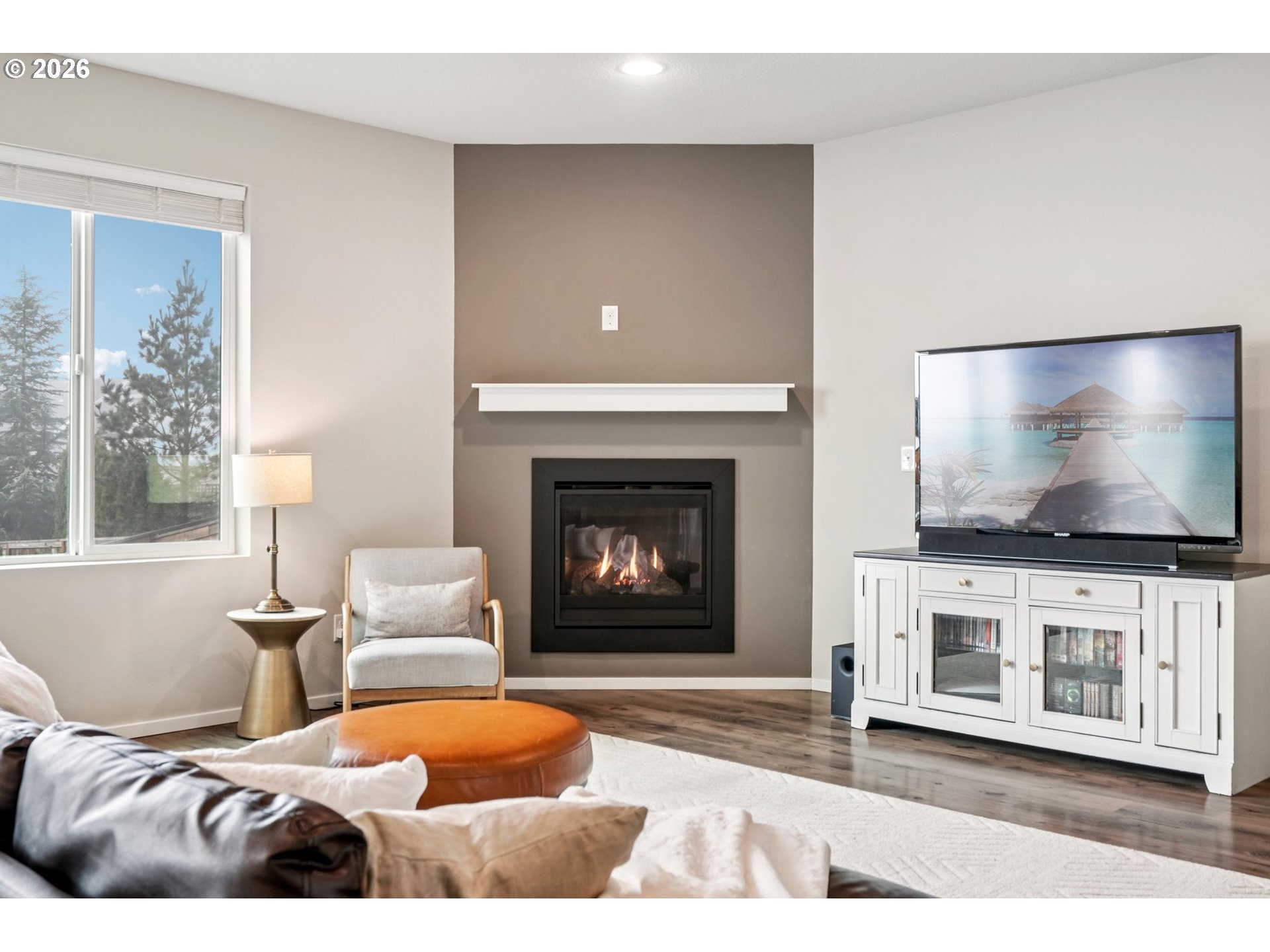1712 Northeast Pioneer Lane Camas, WA 98607 - Photo 5 of 25 a living room with furniture a flat screen tv and a fireplace