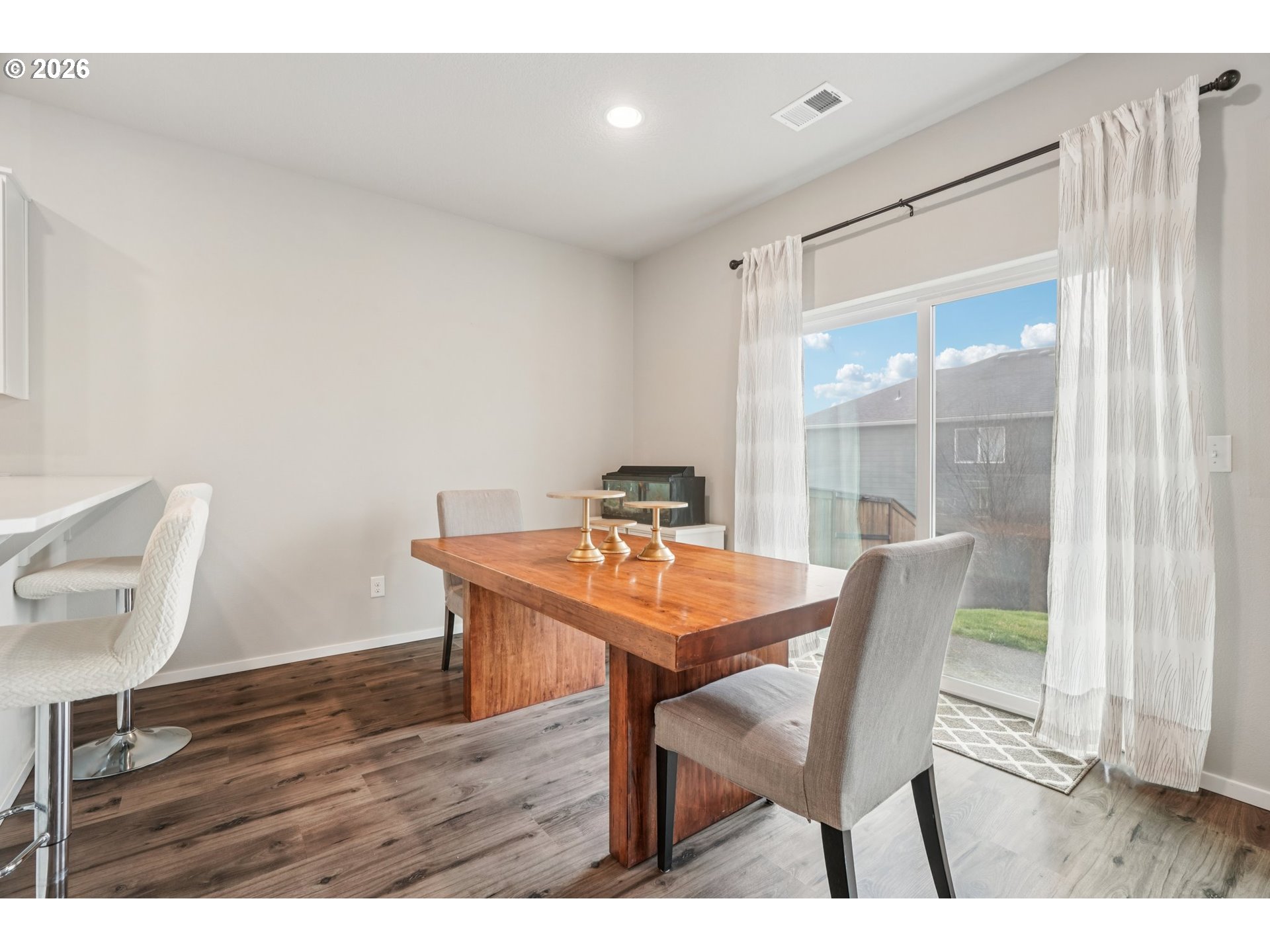 1712 Northeast Pioneer Lane Camas, WA 98607 - Photo 7 of 25 a view of a dining room with furniture and wooden floor
