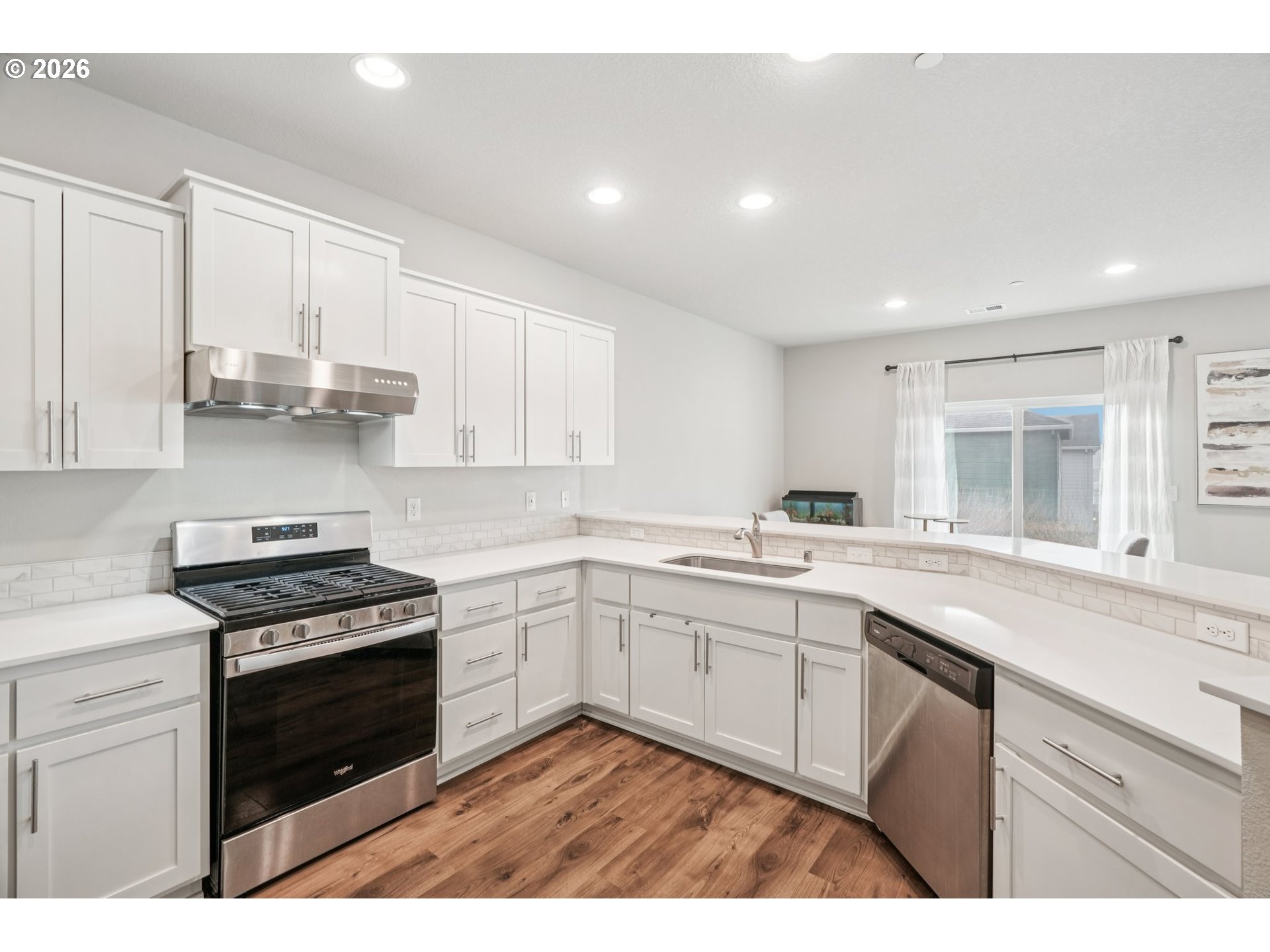1712 Northeast Pioneer Lane Camas, WA 98607 - Photo 10 of 25 a kitchen with a sink stove and cabinets