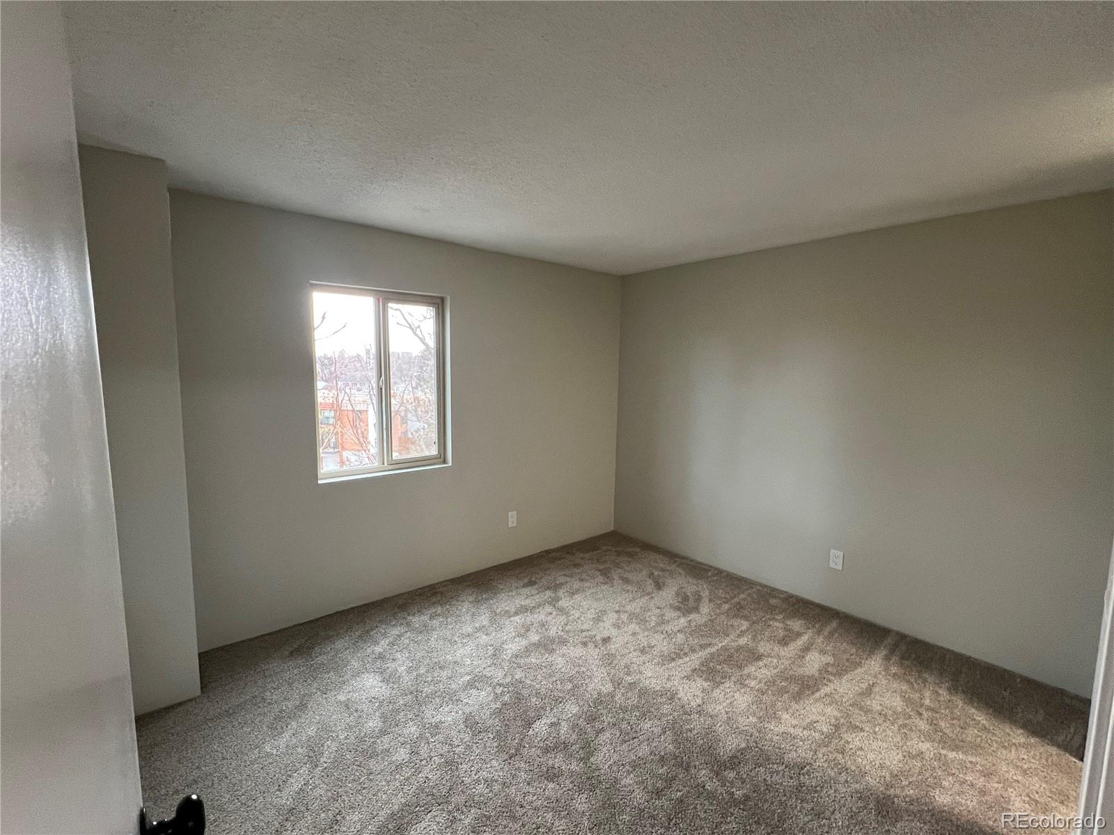 2880 South Locust Street, Unit 507S Denver, CO 80222 - Photo 27 of 48 an empty room with a window