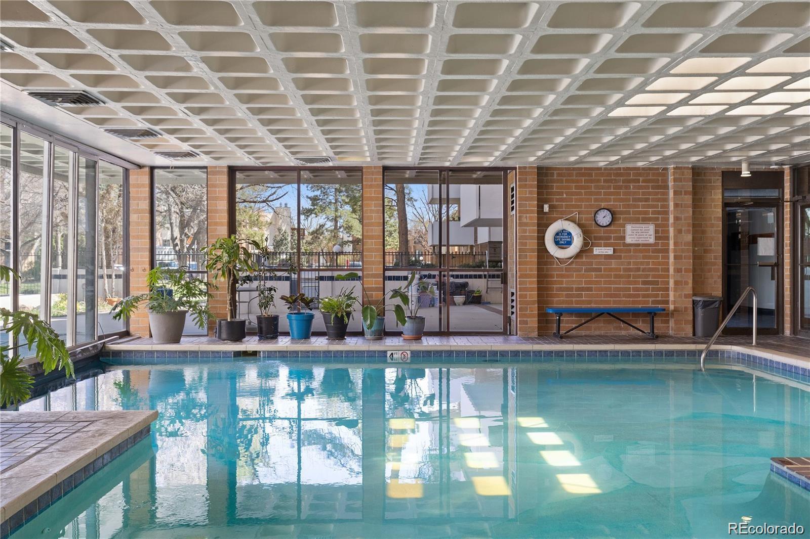 2880 South Locust Street, Unit 507S Denver, CO 80222 - Photo 40 of 48 a roof deck with table and chairs and potted plants