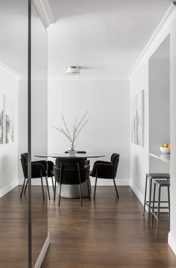 625 Main Street, Unit 1432 Manhattan, NY 10044 - Photo 4 of 12 a view of a dining room with furniture and wooden floor