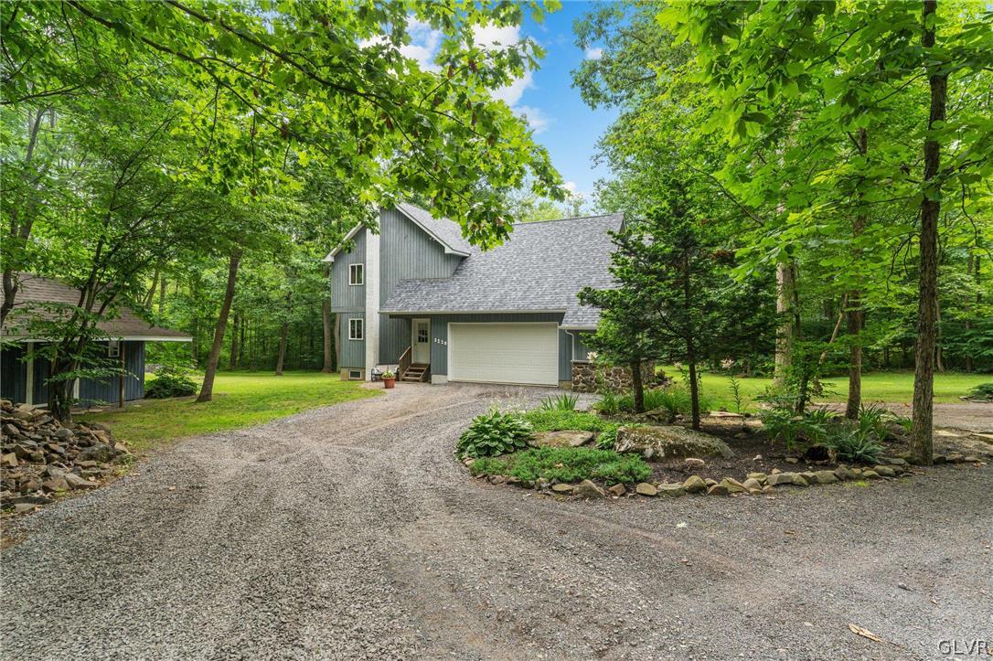 3220 Winding Road Kintnersville, PA 18930 - Photo 14 of 50 a view of a house with a tree and yard