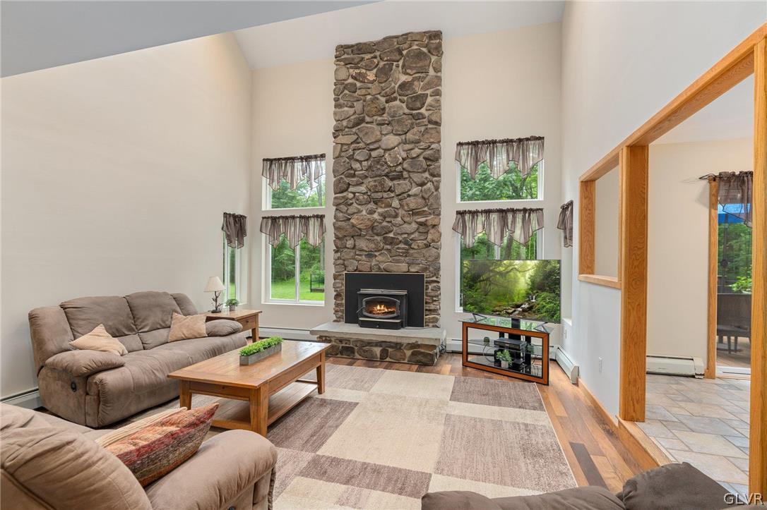 3220 Winding Road Kintnersville, PA 18930 - Photo 19 of 50 a living room with furniture and a fireplace