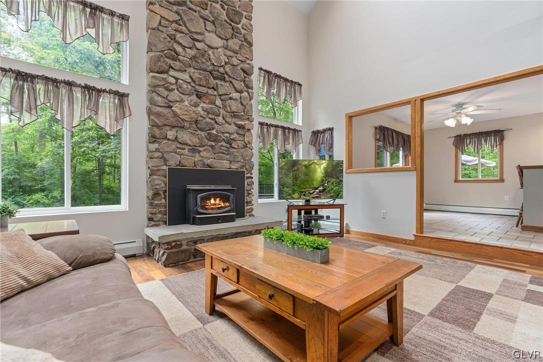 3220 Winding Road Kintnersville, PA 18930 - Photo 22 of 50 a living room with furniture and a fireplace