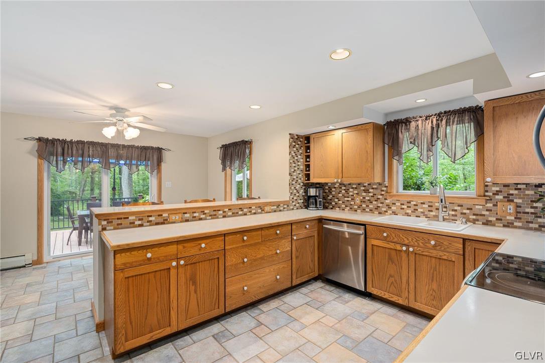 3220 Winding Road Kintnersville, PA 18930 - Photo 25 of 50 a kitchen with a sink stove and cabinets