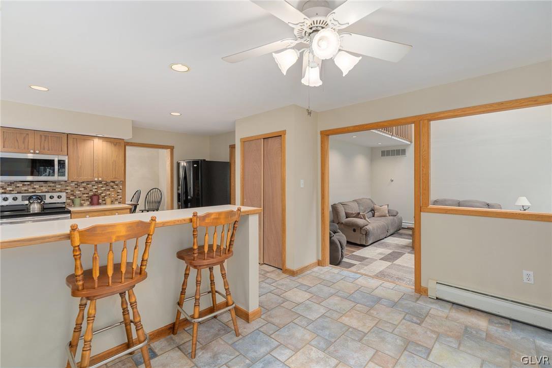 3220 Winding Road Kintnersville, PA 18930 - Photo 29 of 50 a large kitchen with a table and chairs